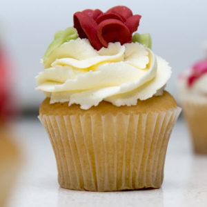 Single cupcake with frosting in the same of a flower