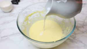 adding milk and vanilla extract